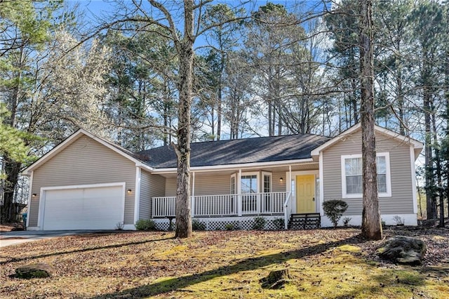 single story home featuring a garage, covered porch, and driveway