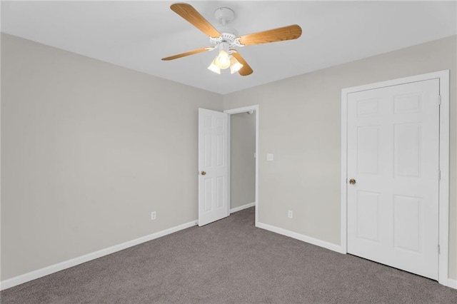 unfurnished bedroom featuring carpet flooring, ceiling fan, and baseboards