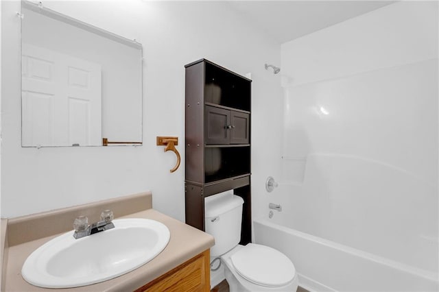 full bathroom featuring toilet, vanity, and bathtub / shower combination