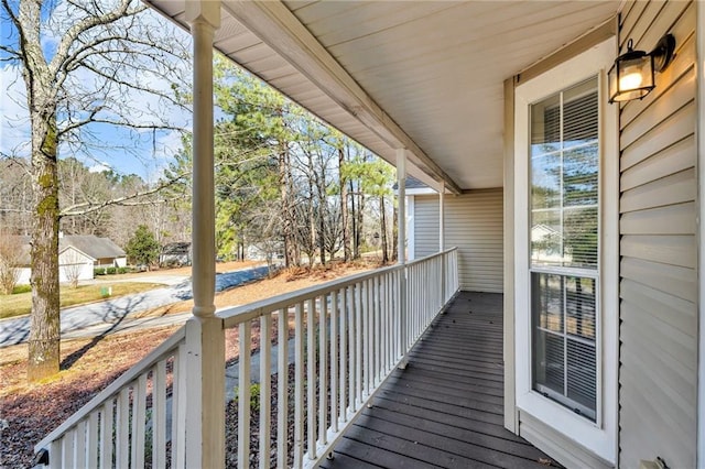 wooden terrace featuring covered porch