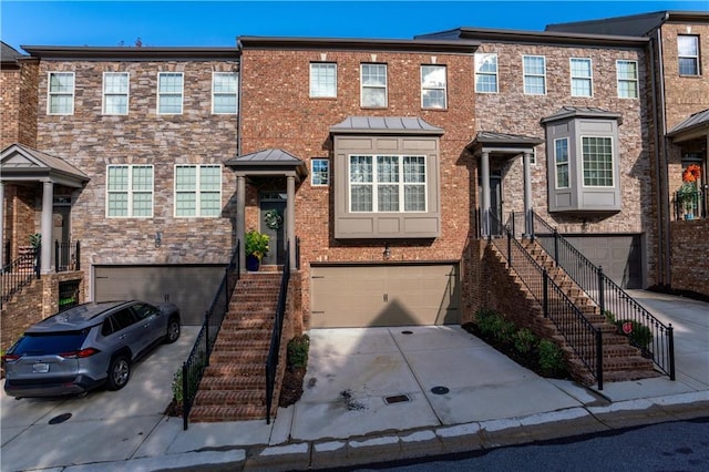 multi unit property featuring a garage