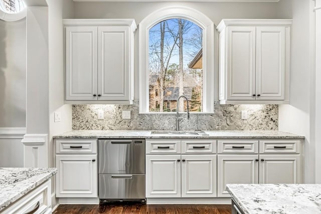 47 Fern Leaf Way, Newnan, GA 30265 - kitchen with a sink, stainless steel dishwasher, white cabinets, and backsplash