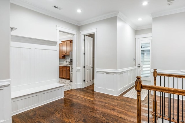 47 Fern Leaf Way, Newnan, GA 30265 - hallway with dark wood-style floors, a decorative wall, crown molding, recessed lighting, and wainscoting