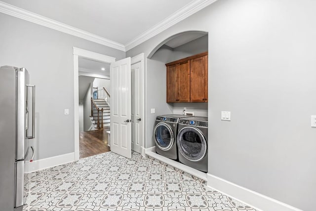 47 Fern Leaf Way, Newnan, GA 30265 - washroom with independent washer and dryer, cabinet space, ornamental molding, arched walkways, and baseboards