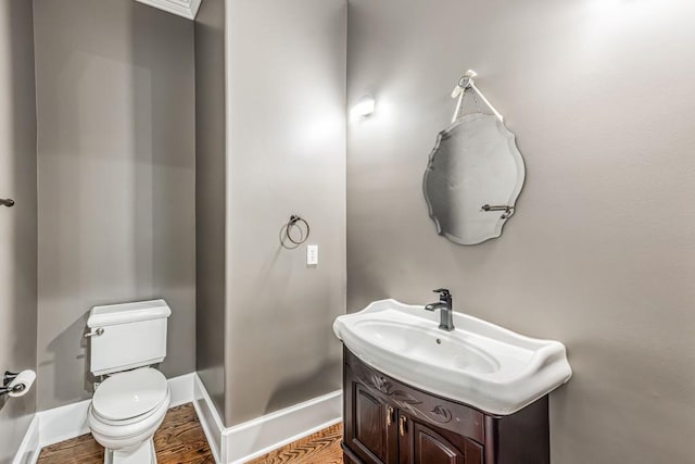 47 Fern Leaf Way, Newnan, GA 30265 - bathroom with toilet, vanity, wood finished floors, and baseboards