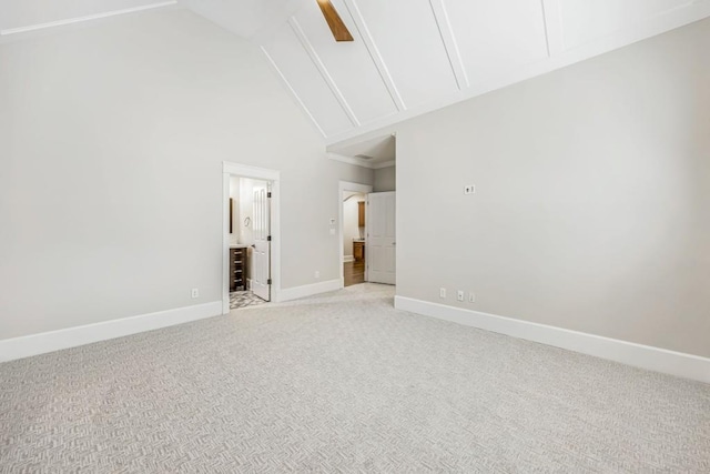 47 Fern Leaf Way, Newnan, GA 30265 - empty room featuring light carpet, baseboards, and high vaulted ceiling
