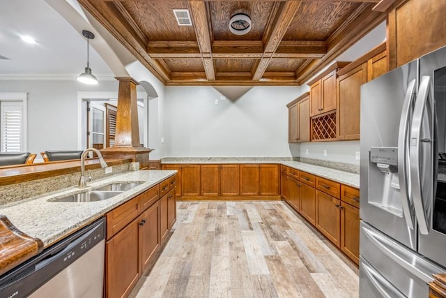 47 Fern Leaf Way, Newnan, GA 30265 - kitchen with stainless steel appliances, a sink, wooden ceiling with exposed beams, decorative columns, and brown cabinetry