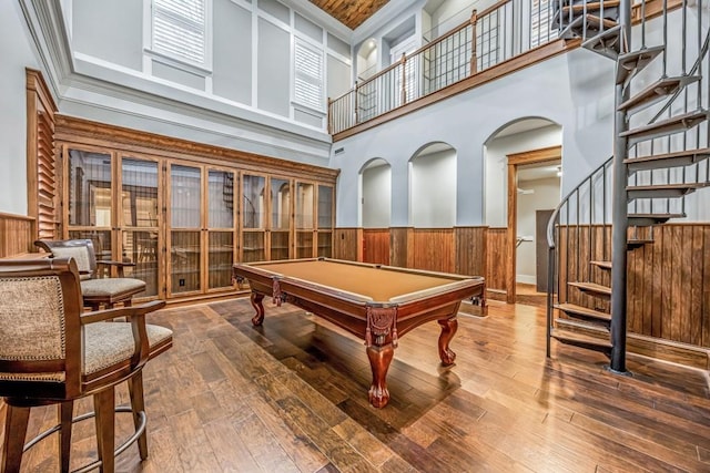 47 Fern Leaf Way, Newnan, GA 30265 - rec room with wainscoting, a towering ceiling, wooden walls, wood-type flooring, and billiards