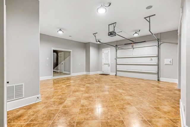 47 Fern Leaf Way, Newnan, GA 30265 - garage featuring a garage door opener and baseboards