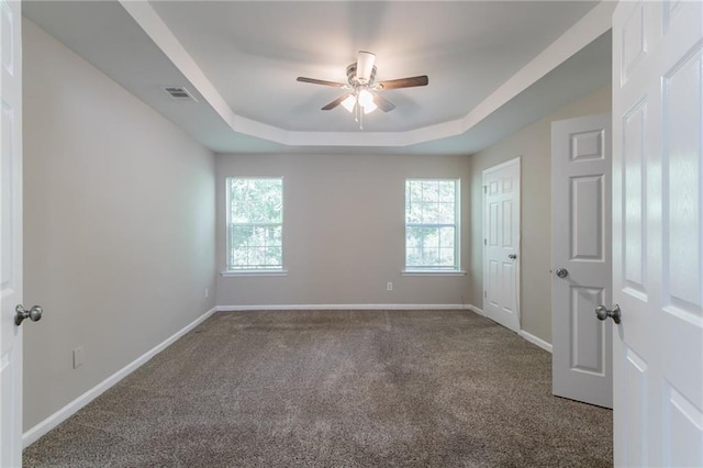 3732 Landgraf Cv, Decatur, GA 30034 - empty room featuring ceiling fan, carpet flooring, a tray ceiling, and baseboards