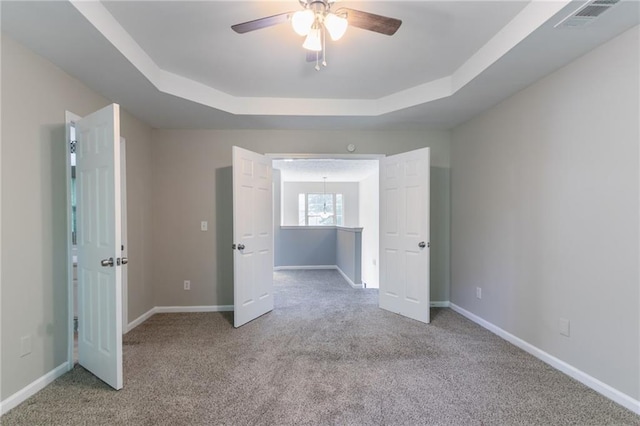 3732 Landgraf Cv, Decatur, GA 30034 - carpeted empty room featuring ceiling fan, a tray ceiling, and baseboards