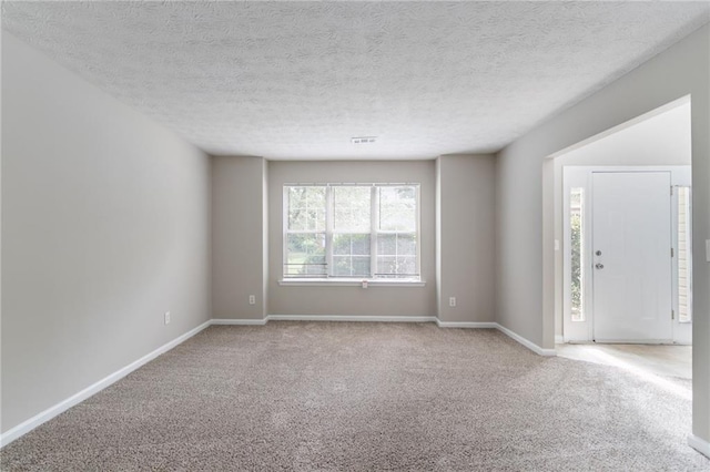 3732 Landgraf Cv, Decatur, GA 30034 - carpeted spare room with baseboards and a textured ceiling