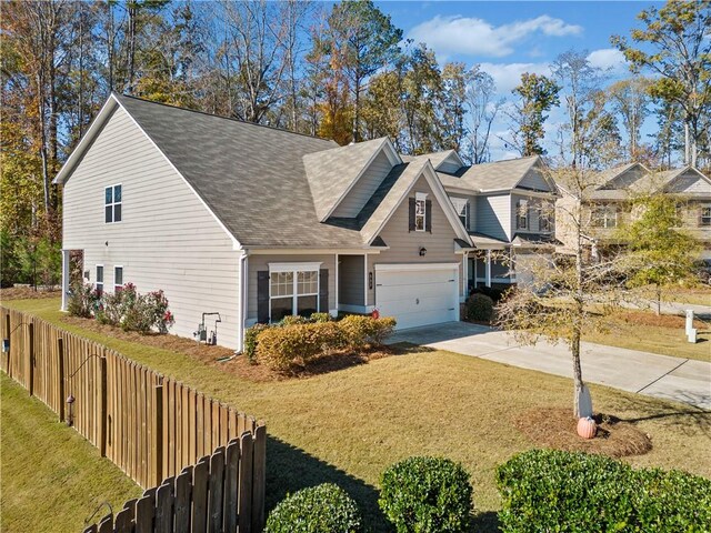 view of front of house featuring a garage and a front yard