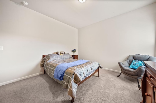 bedroom with light colored carpet