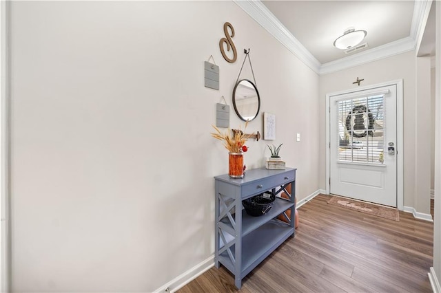 entryway with crown molding and hardwood / wood-style floors