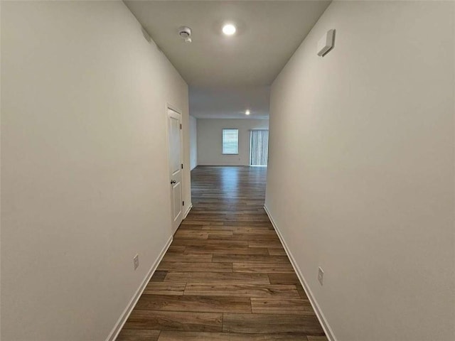 hall with dark hardwood / wood-style flooring