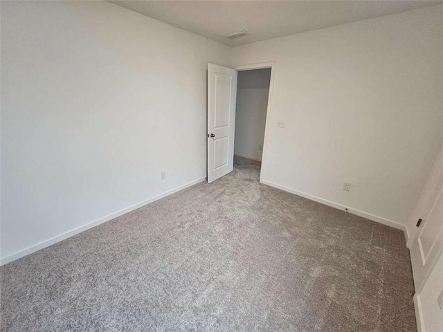 spare room featuring carpet flooring