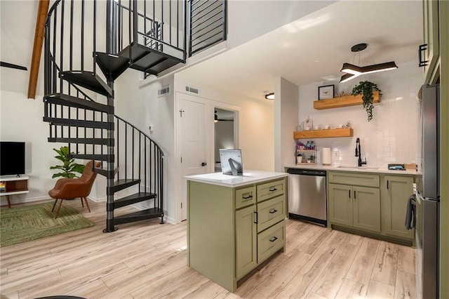 834 Lower Bell Creek Rd, Hiawassee, GA 30546 - kitchen featuring green cabinetry, appliances with stainless steel finishes, light wood finished floors, and light countertops