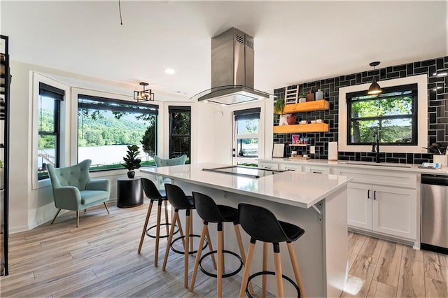 834 Lower Bell Creek Rd, Hiawassee, GA 30546 - kitchen with island exhaust hood, dishwasher, black electric cooktop, white cabinets, and light countertops