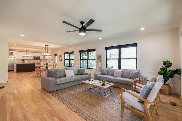 834 Lower Bell Creek Rd, Hiawassee, GA 30546 - living room with light wood-style flooring, ceiling fan, recessed lighting, and a chandelier
