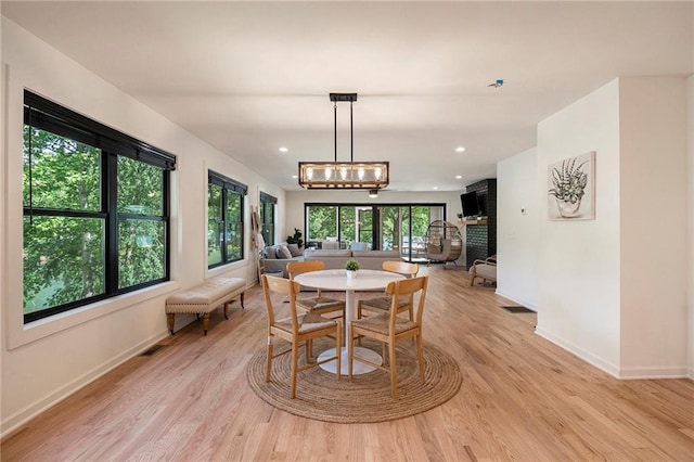834 Lower Bell Creek Rd, Hiawassee, GA 30546 - dining space featuring light wood-style flooring, a chandelier, and recessed lighting