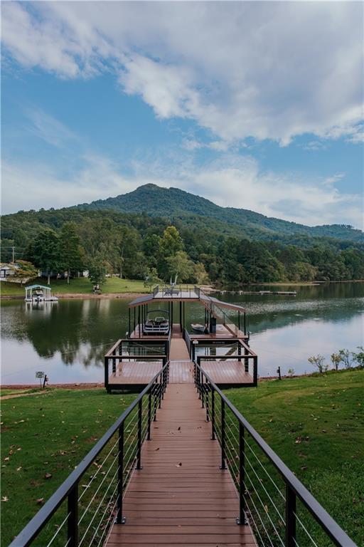 834 Lower Bell Creek Rd, Hiawassee, GA 30546 - dock featuring a water and mountain view, a wooded view, and a yard