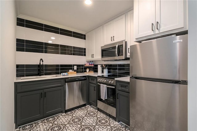 834 Lower Bell Creek Rd, Hiawassee, GA 30546 - kitchen with appliances with stainless steel finishes, light countertops, white cabinetry, backsplash, and gray cabinets