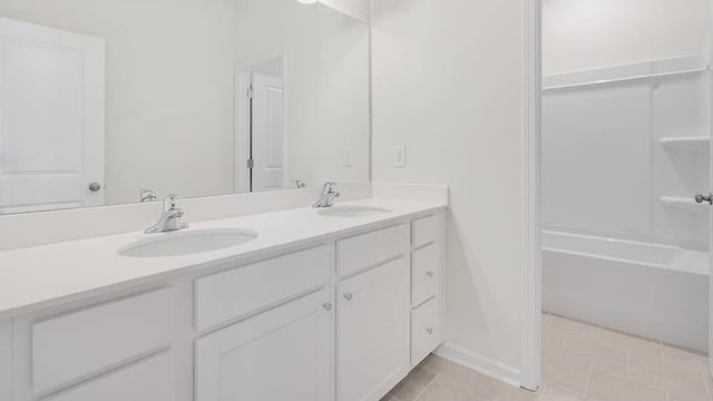 bathroom featuring tile patterned flooring and vanity