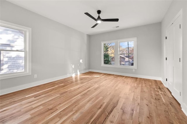 unfurnished bedroom with ceiling fan and light hardwood / wood-style flooring