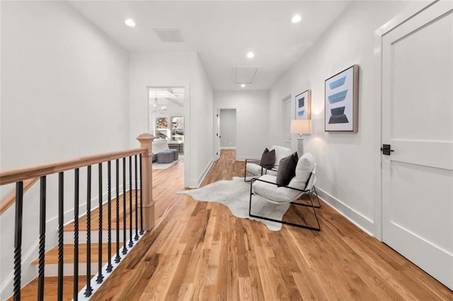 corridor with light hardwood / wood-style flooring