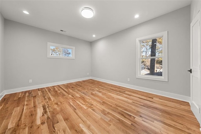 spare room with light hardwood / wood-style floors