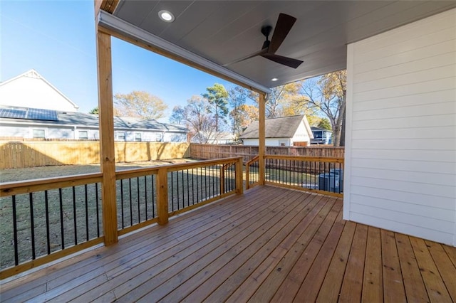 wooden terrace featuring ceiling fan