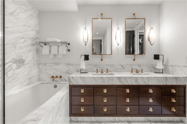 bathroom with a relaxing tiled tub and vanity