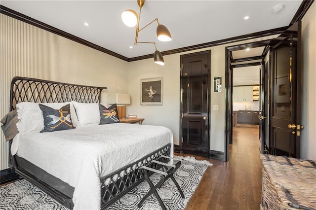 bedroom with crown molding and dark hardwood / wood-style floors