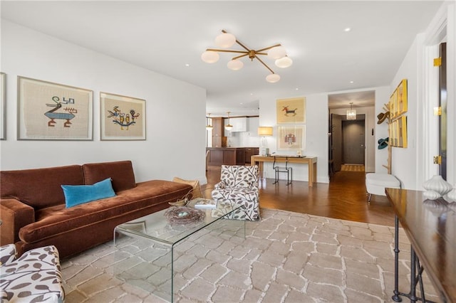 living room with an inviting chandelier and parquet floors