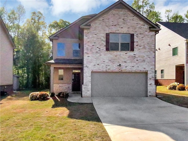 view of front of home featuring a front lawn and a garage