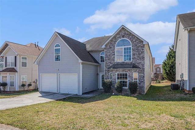 traditional-style home with a garage, stone siding, driveway, and a front lawn