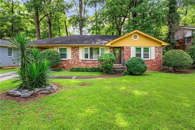 ranch-style house with a front lawn