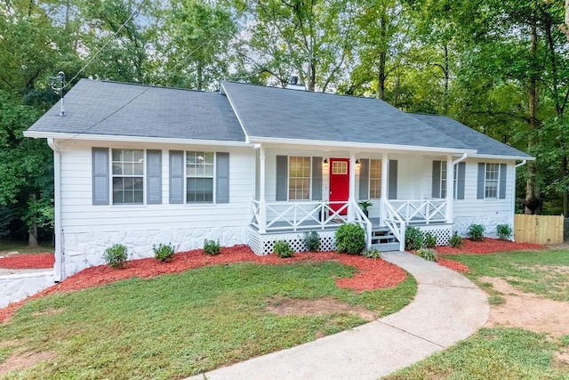 single story home with covered porch and a front lawn