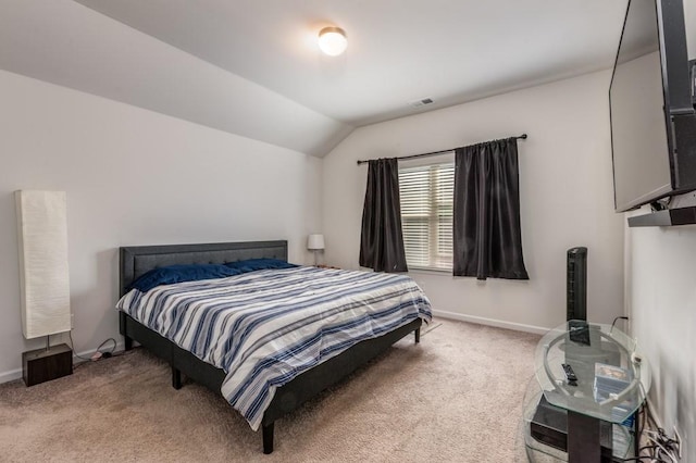 bedroom with lofted ceiling, baseboards, visible vents, and light colored carpet