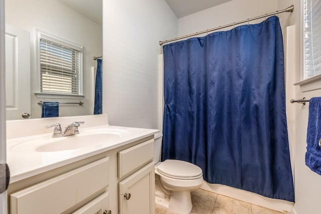 full bath with plenty of natural light, a shower with shower curtain, toilet, tile patterned floors, and vanity