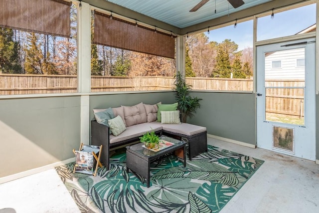 sunroom with a ceiling fan