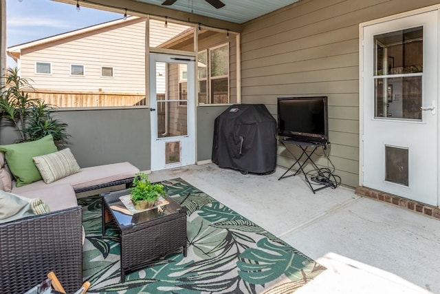 view of patio featuring outdoor lounge area, ceiling fan, fence, and grilling area