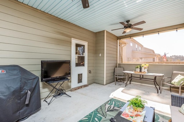 view of patio featuring outdoor lounge area, ceiling fan, and grilling area