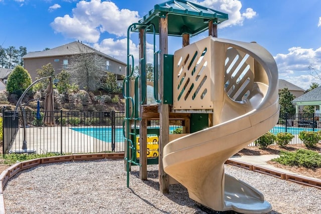 community jungle gym featuring fence