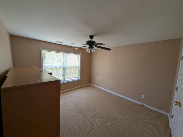 3967 Moos Creek Ct, Loganville, GA 30052 - unfurnished bedroom with visible vents, light colored carpet, baseboards, and a ceiling fan
