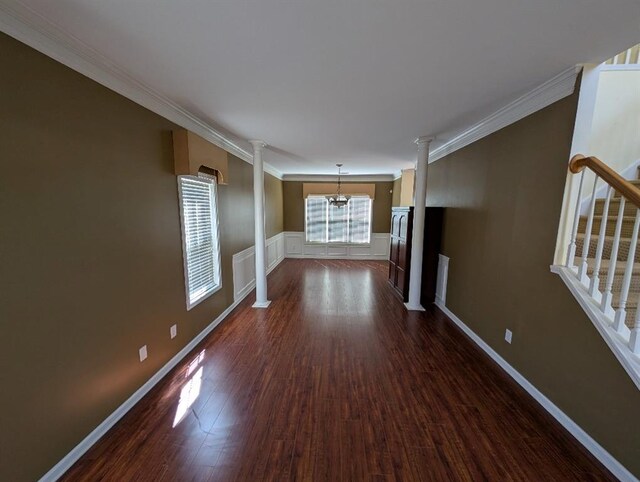 3967 Moos Creek Ct, Loganville, GA 30052 - hall with dark wood-type flooring, decorative columns, a notable chandelier, and ornamental molding
