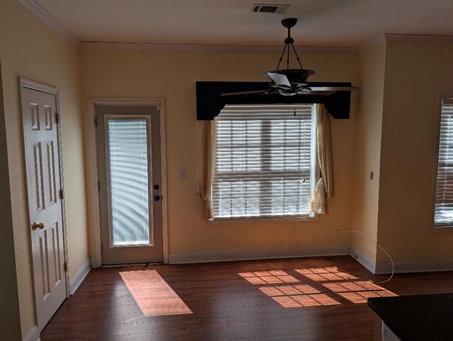 3967 Moos Creek Ct, Loganville, GA 30052 - doorway with wood finished floors, baseboards, ornamental molding, and visible vents