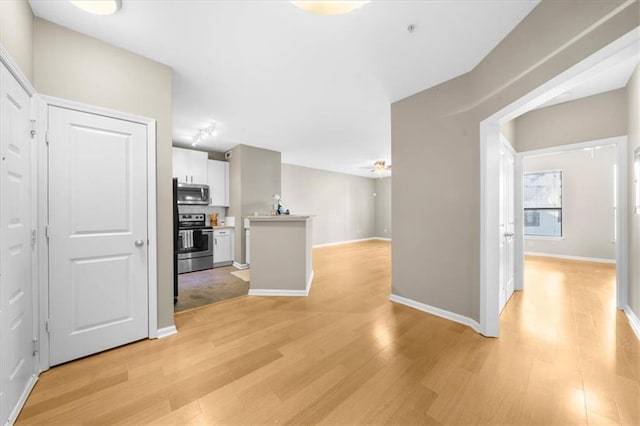 hallway with light wood-type flooring