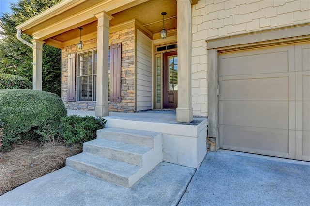 view of exterior entry featuring a garage